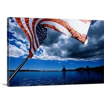 Holger Leue Premium Thick-Wrap Canvas entitled American flag waving in the wind on the water