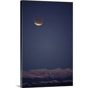 Premium Thick-Wrap Canvas entitled A total lunar eclipse proceeds at dawn over the Mosquito Range of Colorado