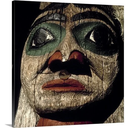 Premium Thick-Wrap Canvas entitled Human face carved on Tlingit Indian totem pole, Ketchikan, Alaska. USA