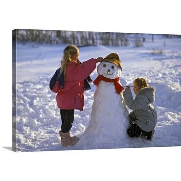 Premium Thick-Wrap Canvas entitled Young girls building a snowman